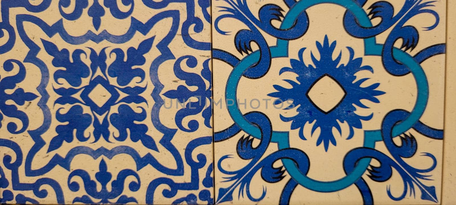 blue and white portuguese tile with drawings by sarsa