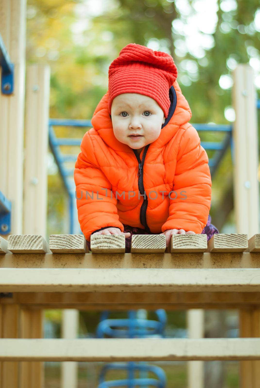 the child climbs the steps on the playground. High quality photo