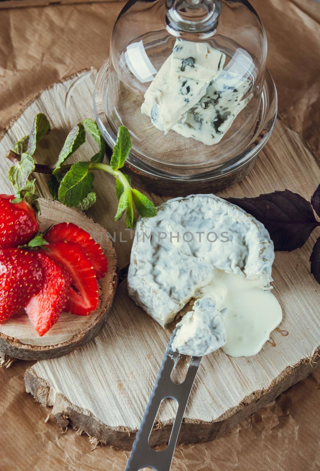 gourmet goat cheese with mold and soft liquid core . High quality photo