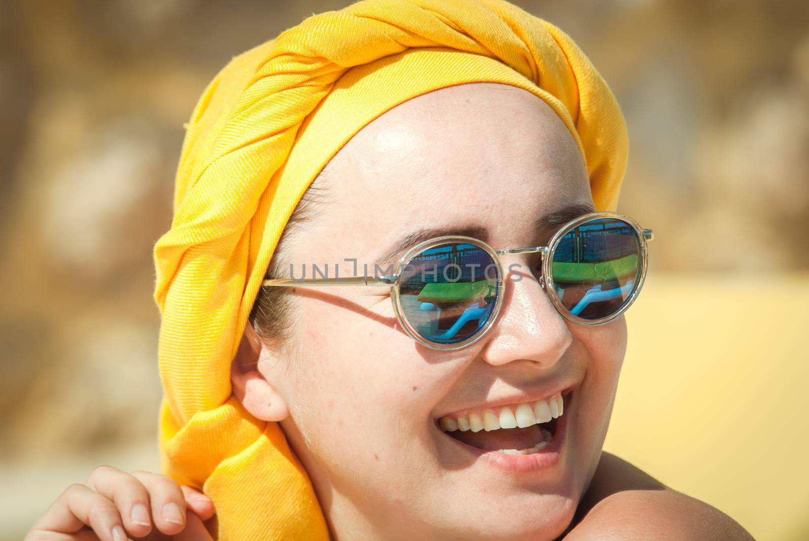 young woman sunbathing at the see terrase in retro swimwear