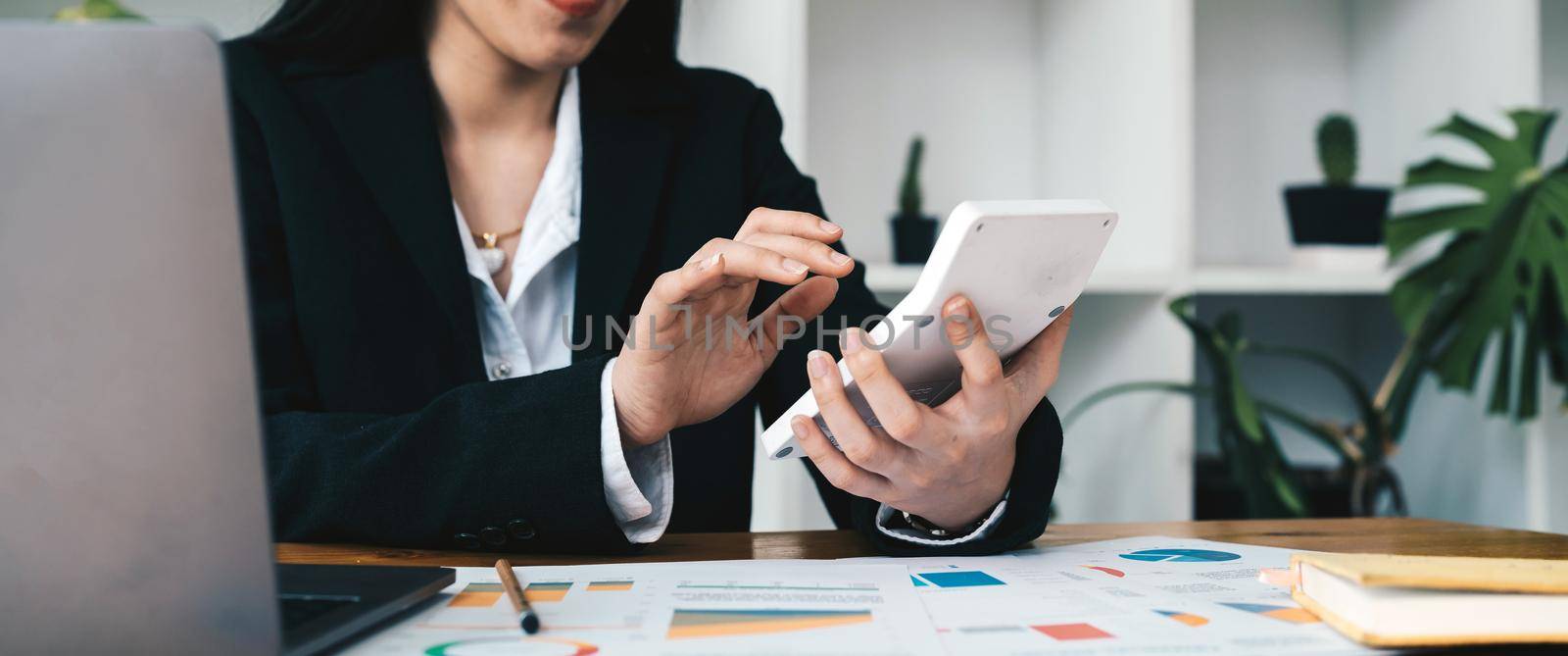 The company's finance manager is using a calculator, he uses a calculator to calculate the numbers in the company's financial documents that employees in the department create as meeting documents