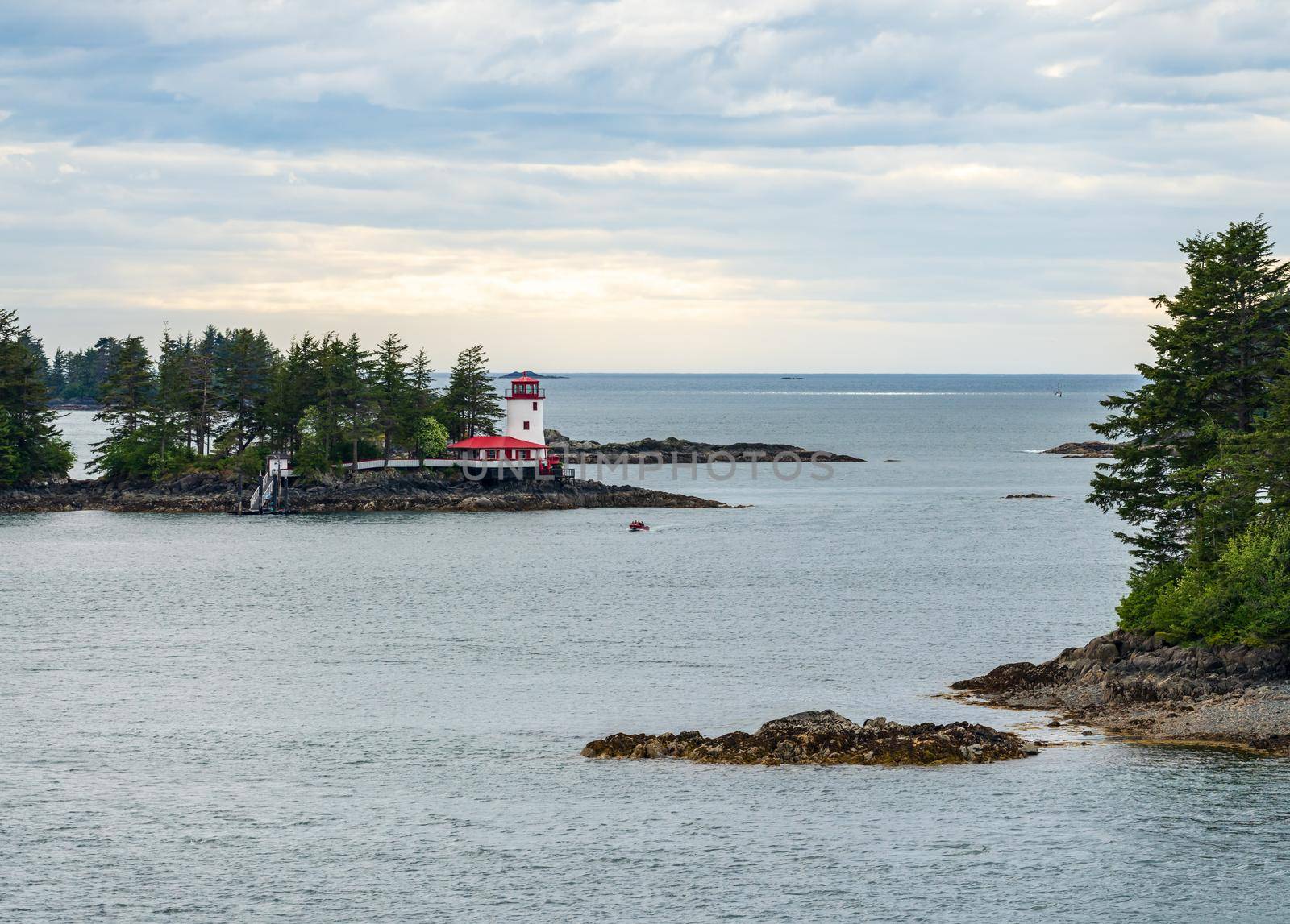 Light house on the rocks on island in the bay of Sitka in Alaska