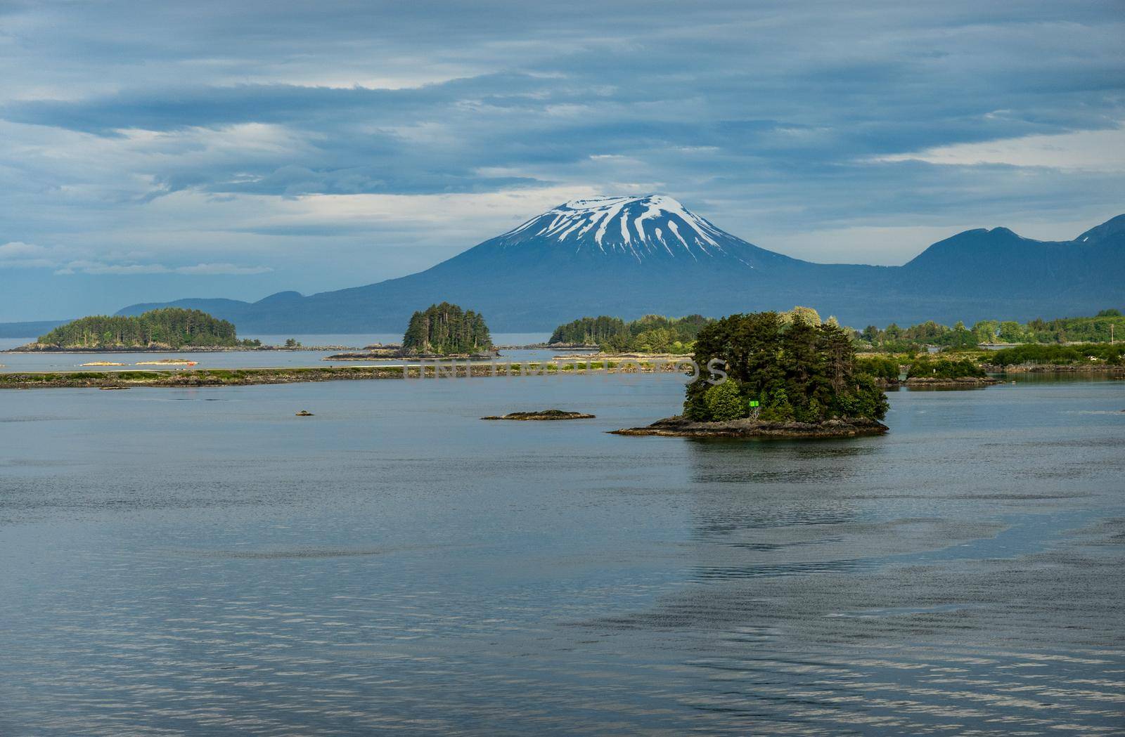 Old volcano of Mt Edgecumbe rises above the islands surrounding Sitka in Alaska