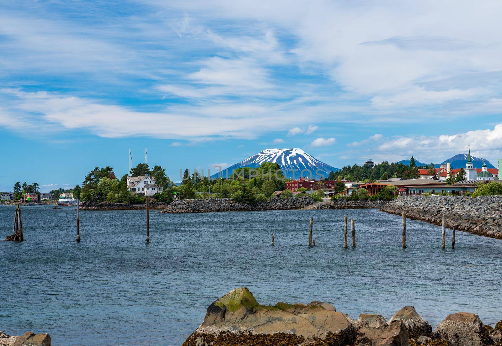 Extinct volcano of Mount Edgecumbe rises above the harbor town of Sitka in Alaska