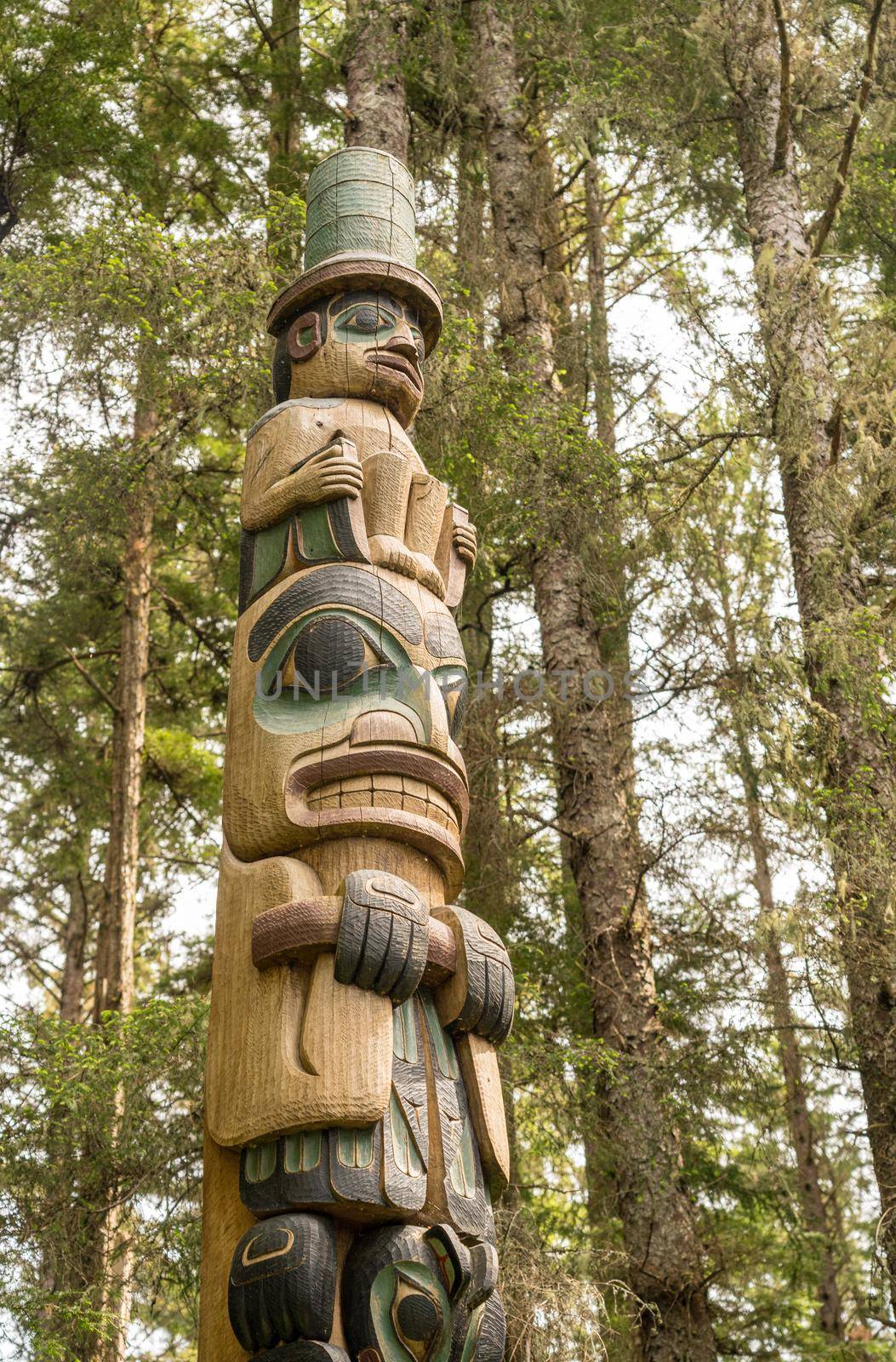 Detail of carved totem pole in the Sitka National Historical Park in Alaska by steheap