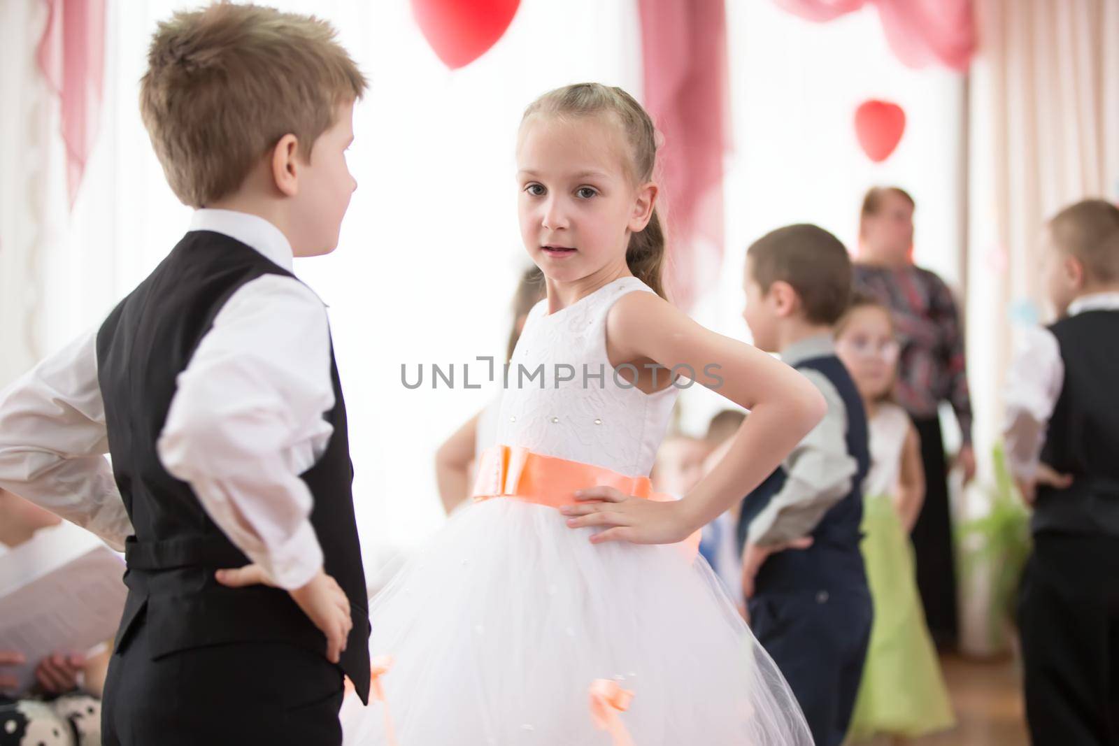 Belarus, Gomel, 6 March 2018. Kindergarten is the fifth. Children's holiday matinee.Little boy and girl are dancing waltz.