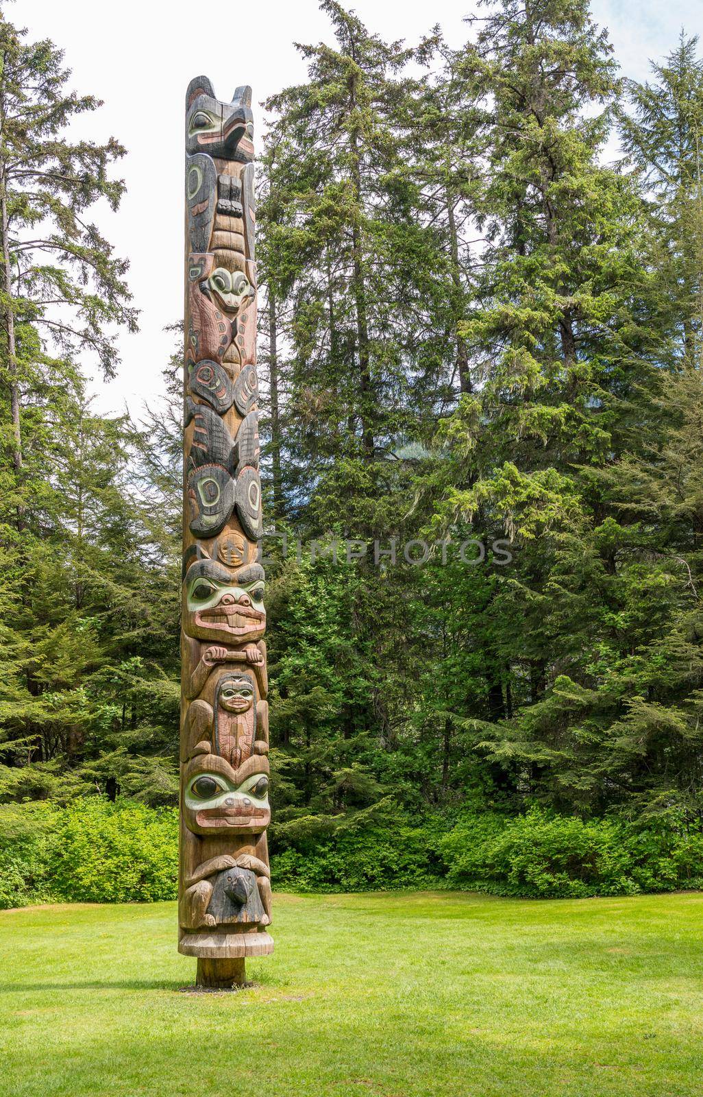 Detail of carved totem pole in the Sitka National Historical Park in Alaska by steheap