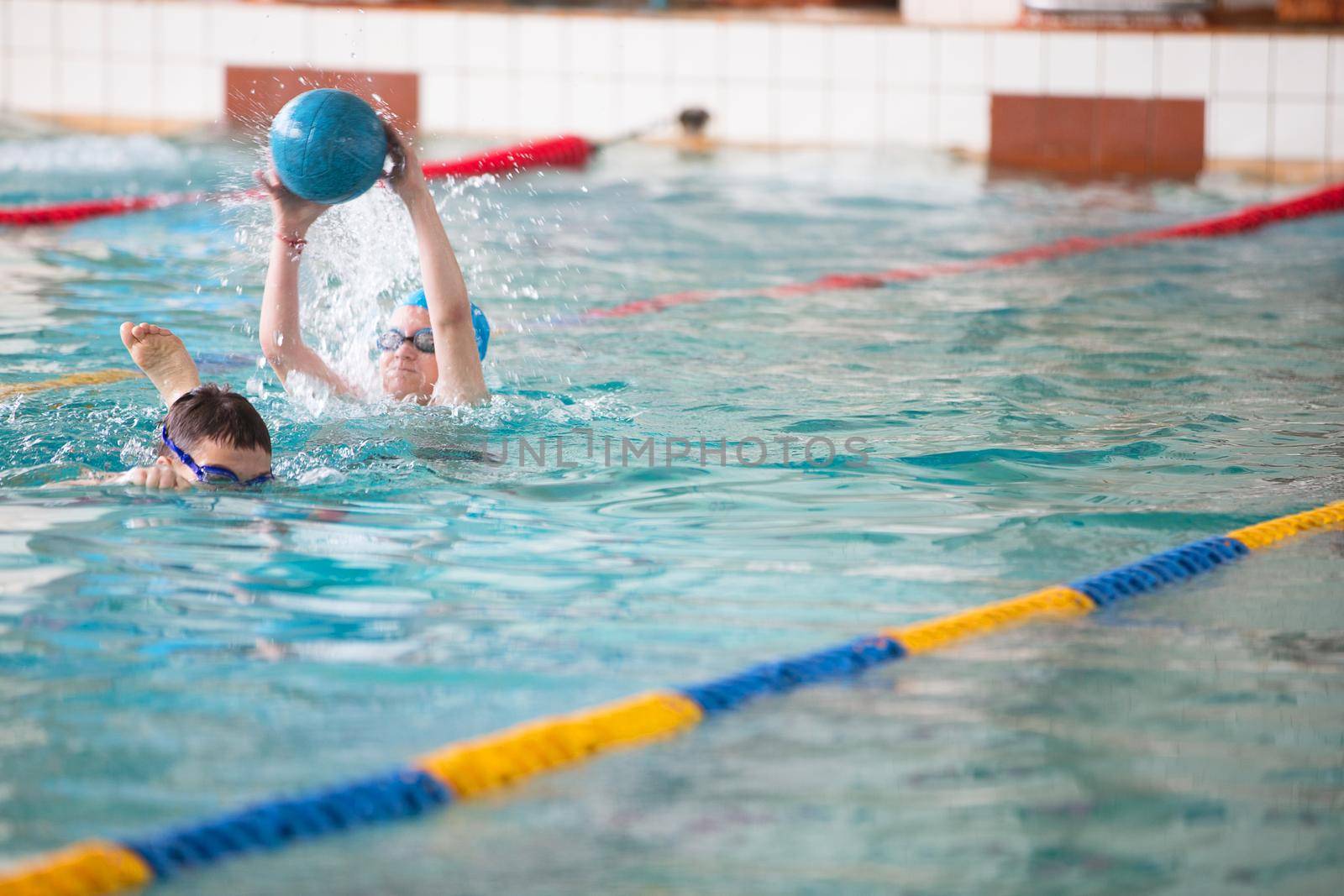 Belarus, Gomel, April 27, 2018. Sports pool. Children's swim training.Children in the pool play ball