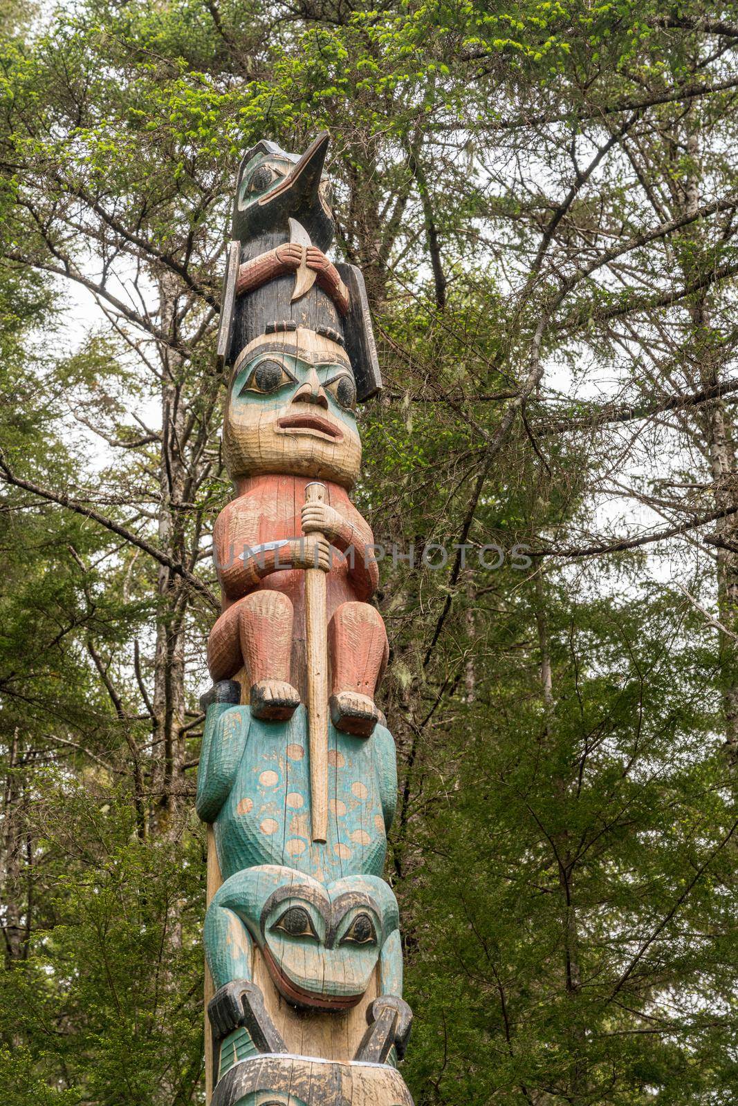 Detail of carved totem pole in the Sitka National Historical Park in Alaska by steheap