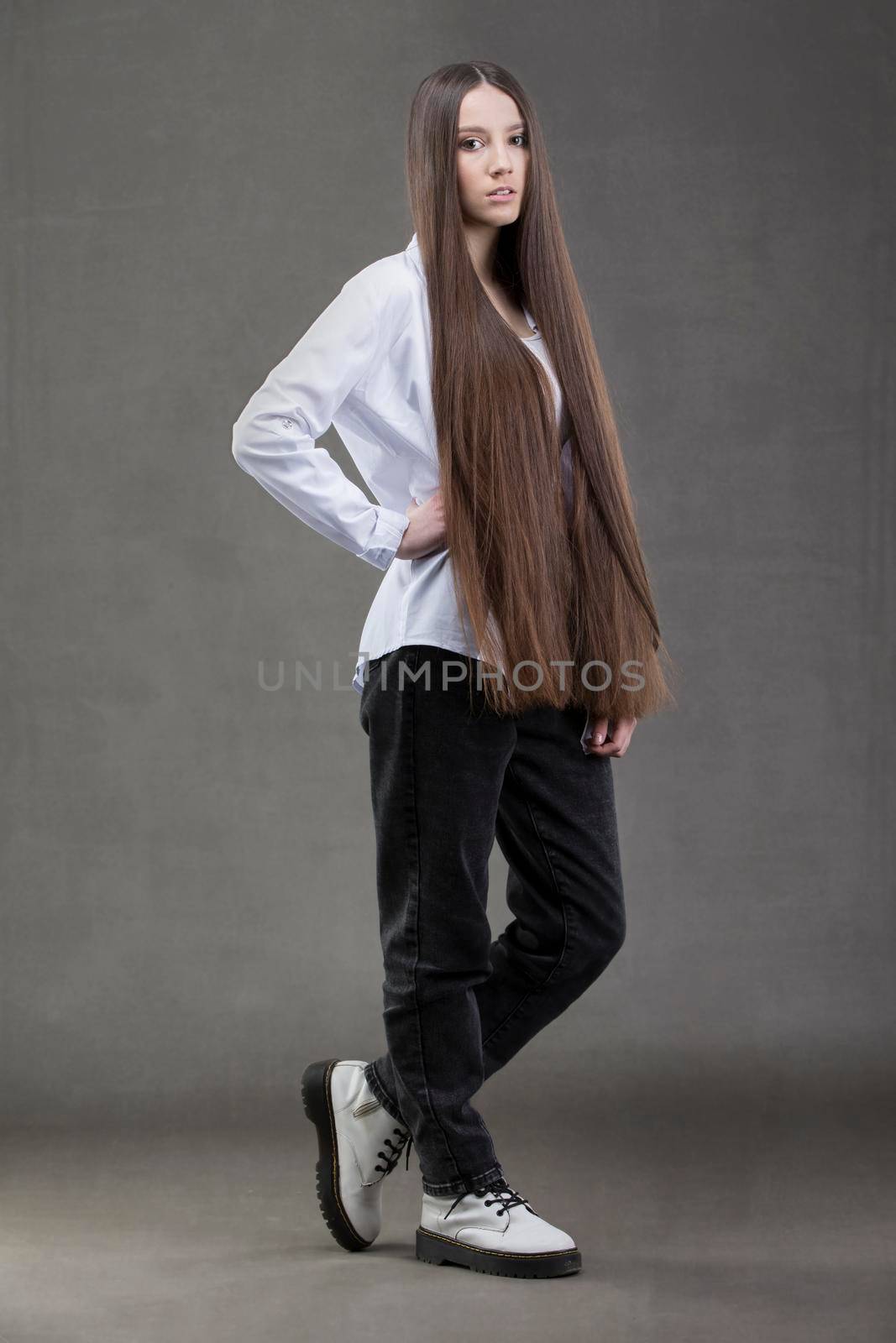 A beautiful young girl in height with long dark hair.