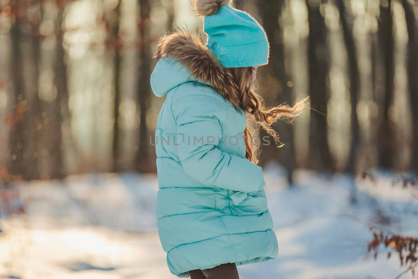girl in the winter forest and turquoise-colored clothes by zokov