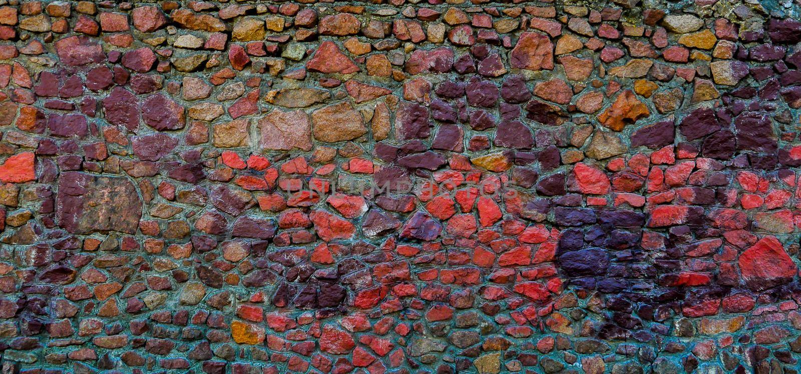 View of the wall of red, blue, brown, purple stones.