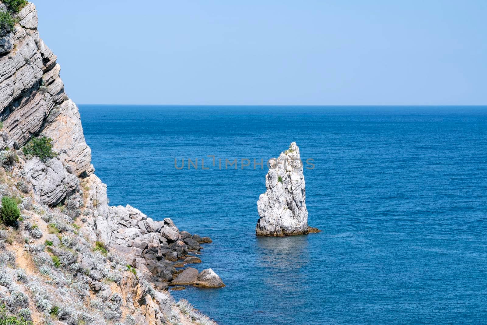 rocks in the sea against the blue sky. High quality photo