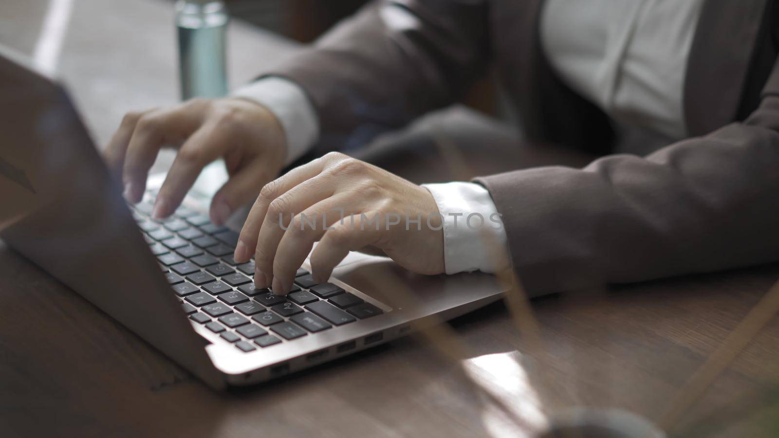 Business Woman In Suit Works With Laptop Sitting At Office Desk With Sanitizer And Incense Sticks On It, Close Up Of Female Hands Typing On Laptop Keyboard