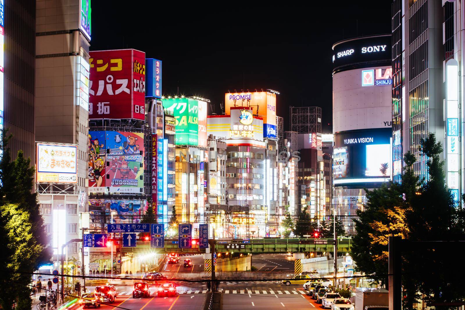 Shinjuku, Japan, May 18 2019: Neon signs illuminate Tokyo s busy Shinjuku neighborhood at night along Yasukuni Dori Ave