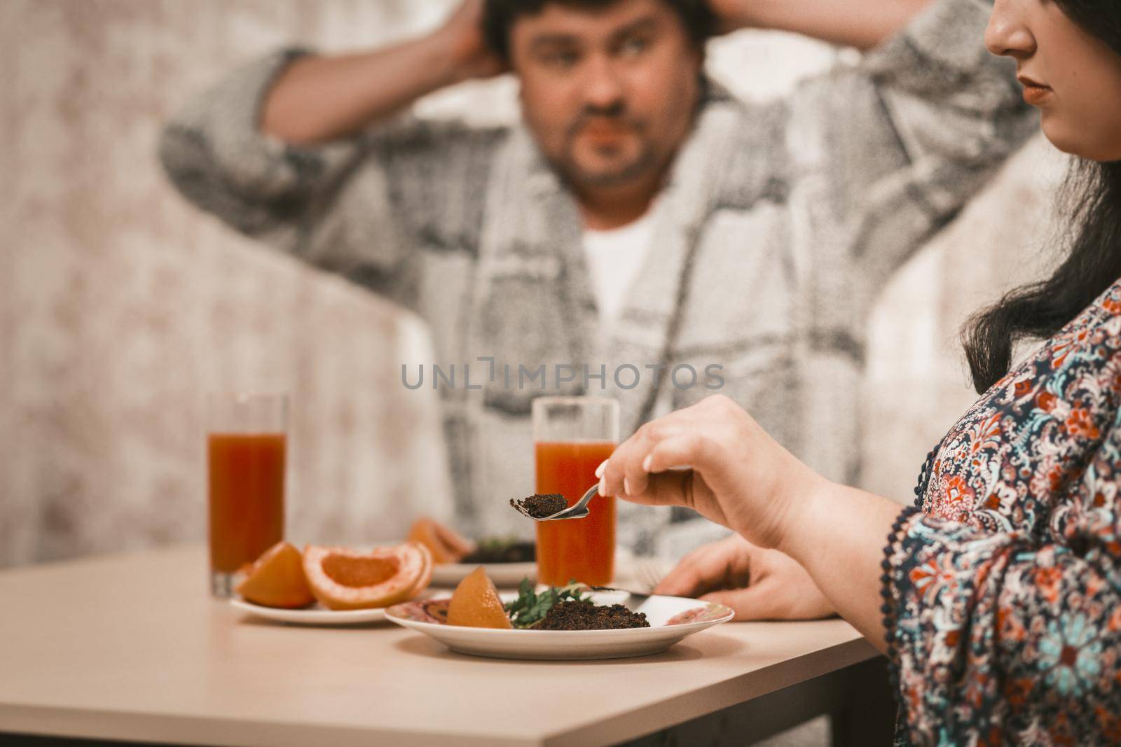 Plus Size Couple About To Eat Healthy Food, Selective Focus On Body Positive Woman Holding Fork In Foreground And Picking Salad From A Plate