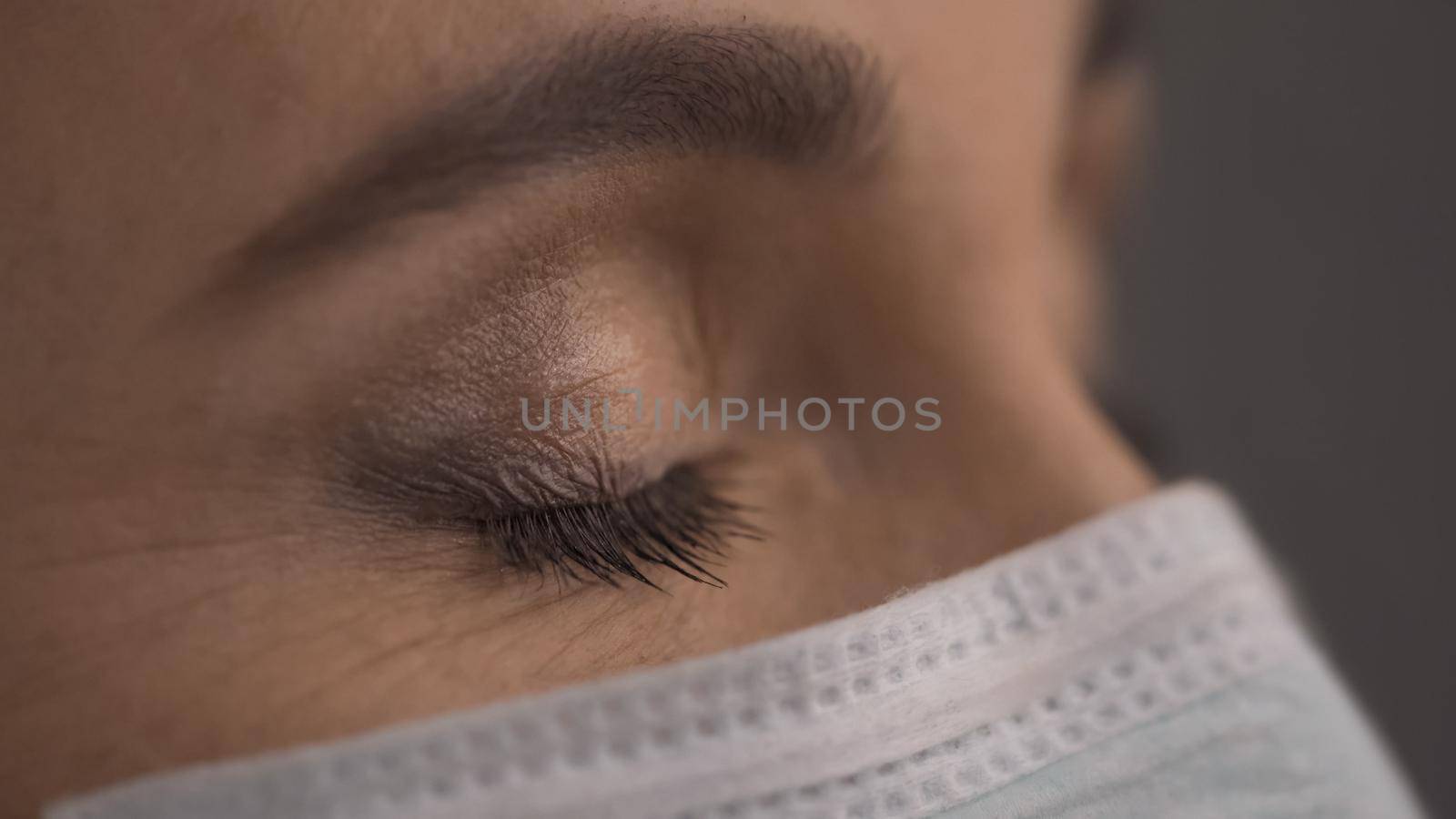 Profile View Of Tired Medic Exhausted During Coronavirus Epidemic, Close Up Of Caucasian Female Doctor's Face In Protective Mask, Pandemic Concept