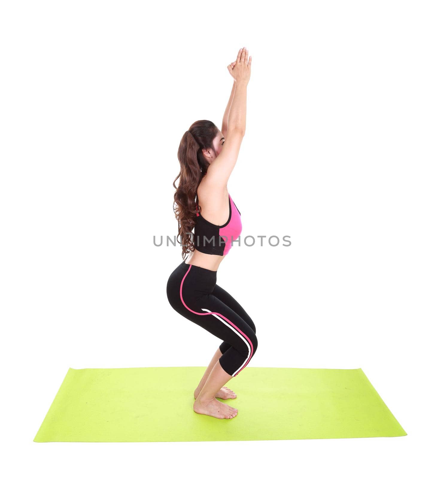 Young woman doing yoga exercise by geargodz
