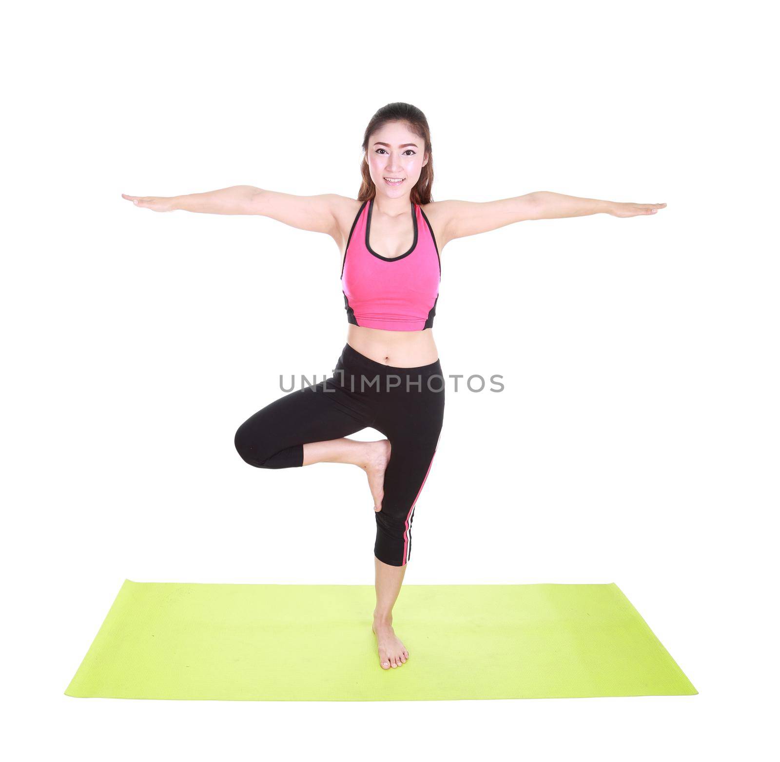 Young woman doing yoga exercise with yoga mat isolated on white background