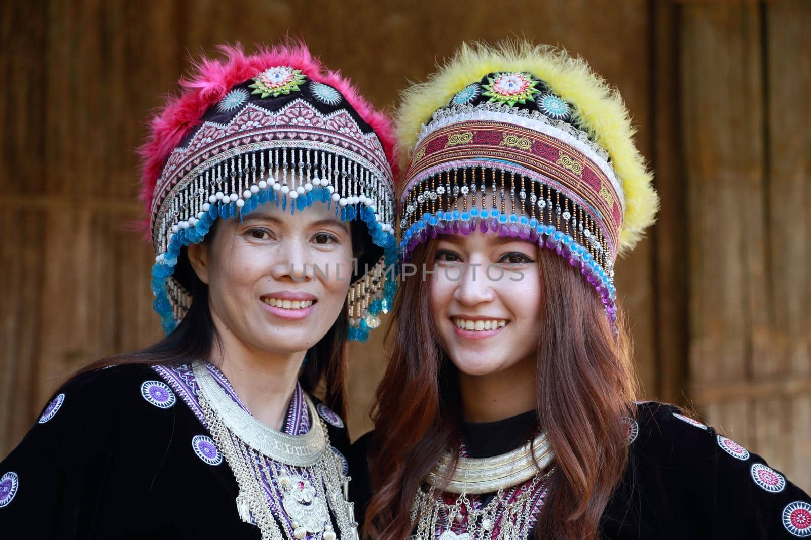 Traditionally dressed Mhong hill tribe woman in the wooden cottage