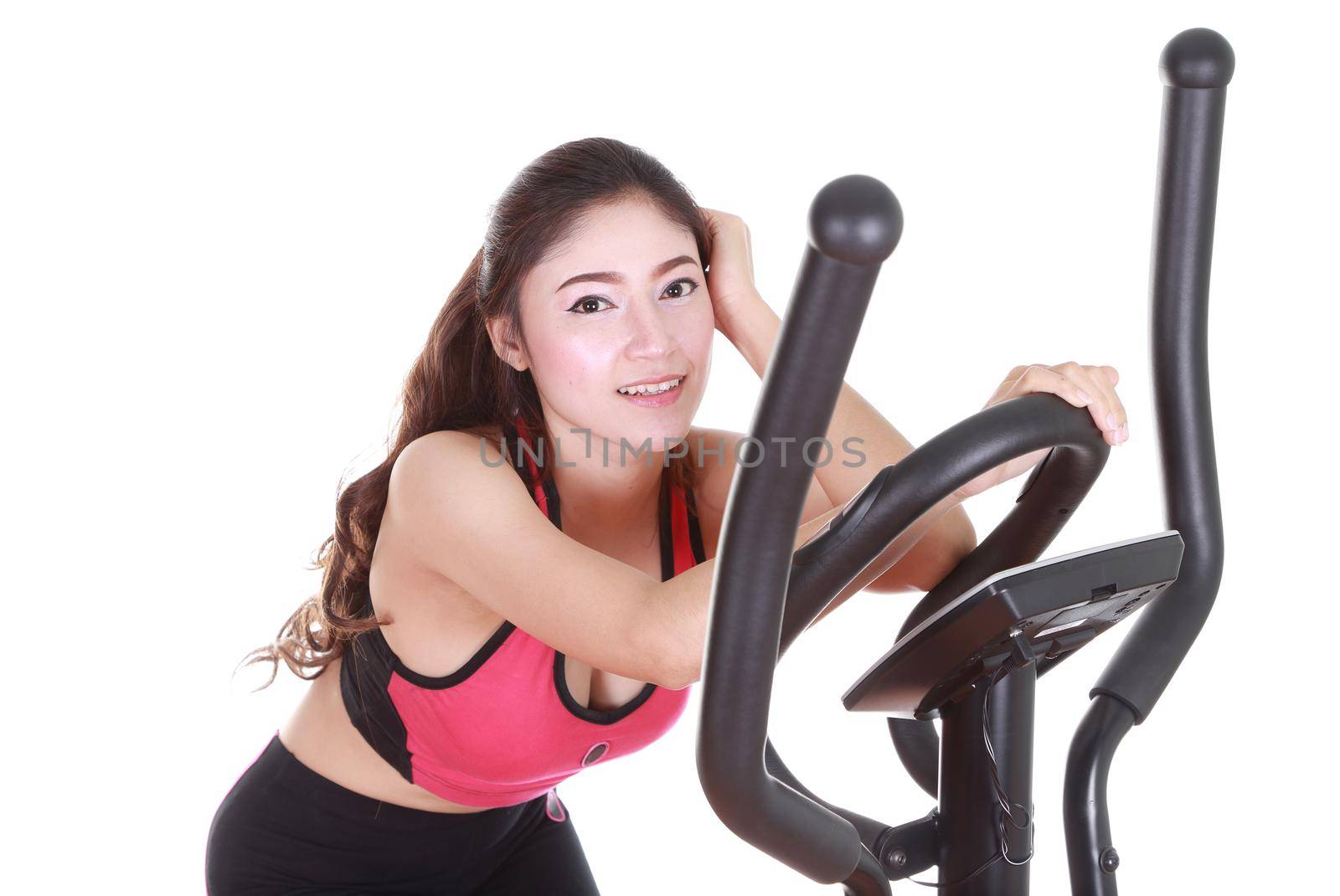 young woman doing exercises with exercise machine, on white background