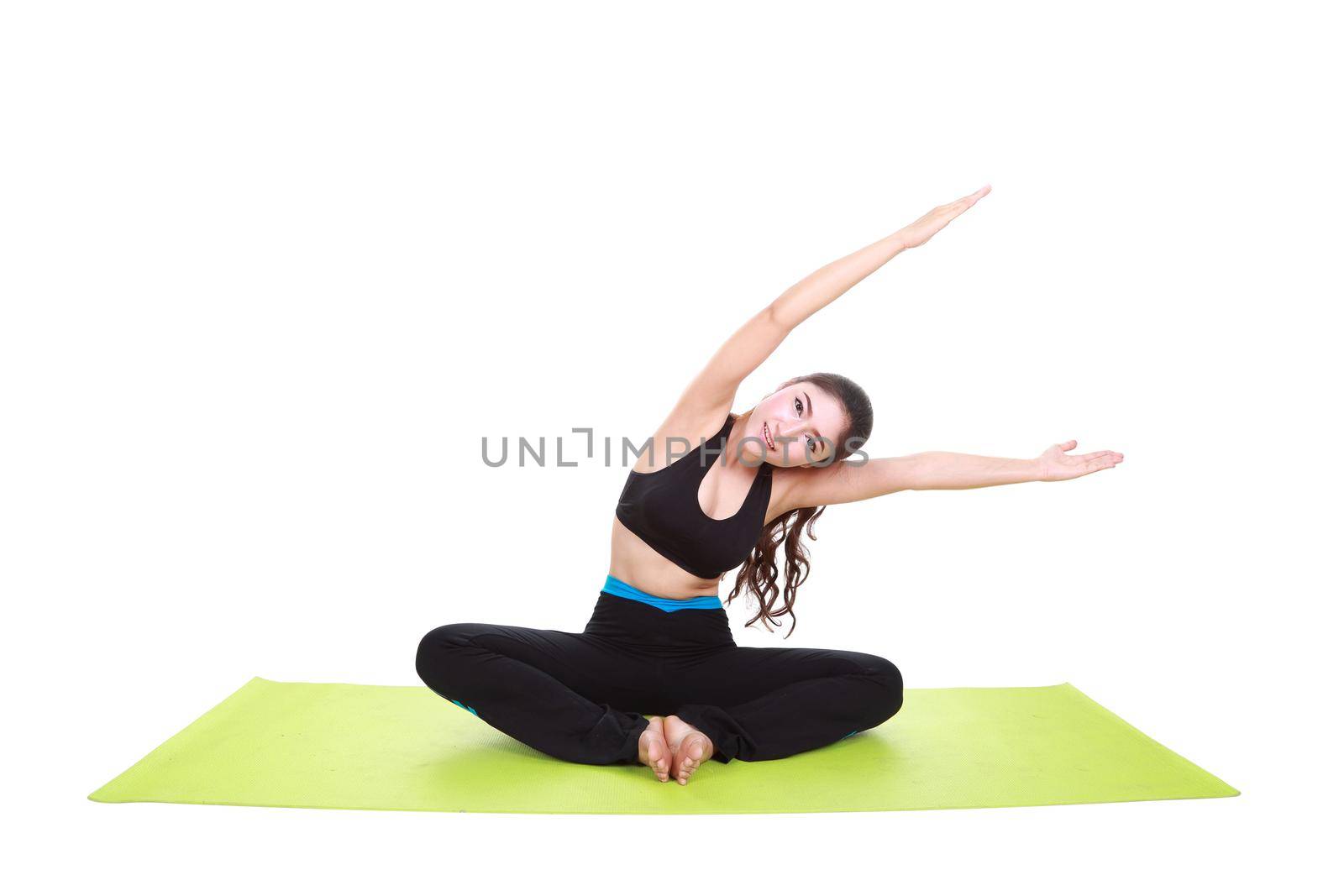 Young woman doing yoga exercise with yoga mat isolated on white background