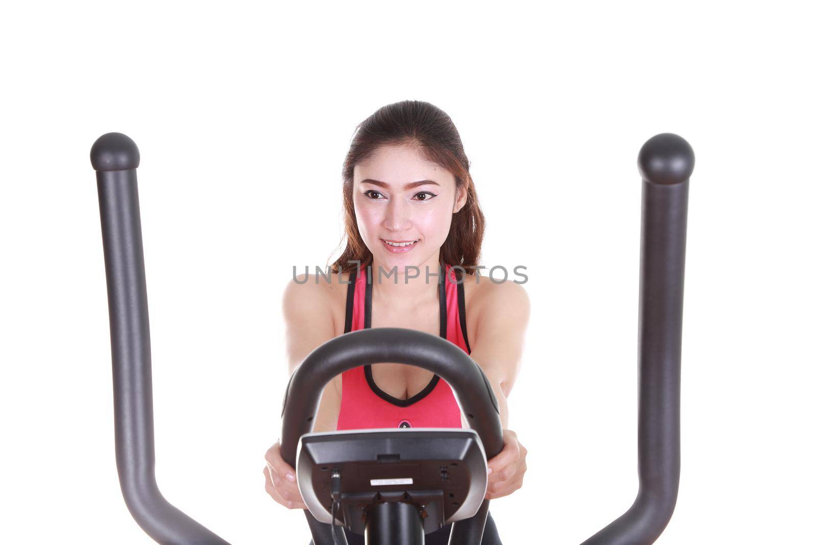 young woman doing exercises with exercise machine, on white background