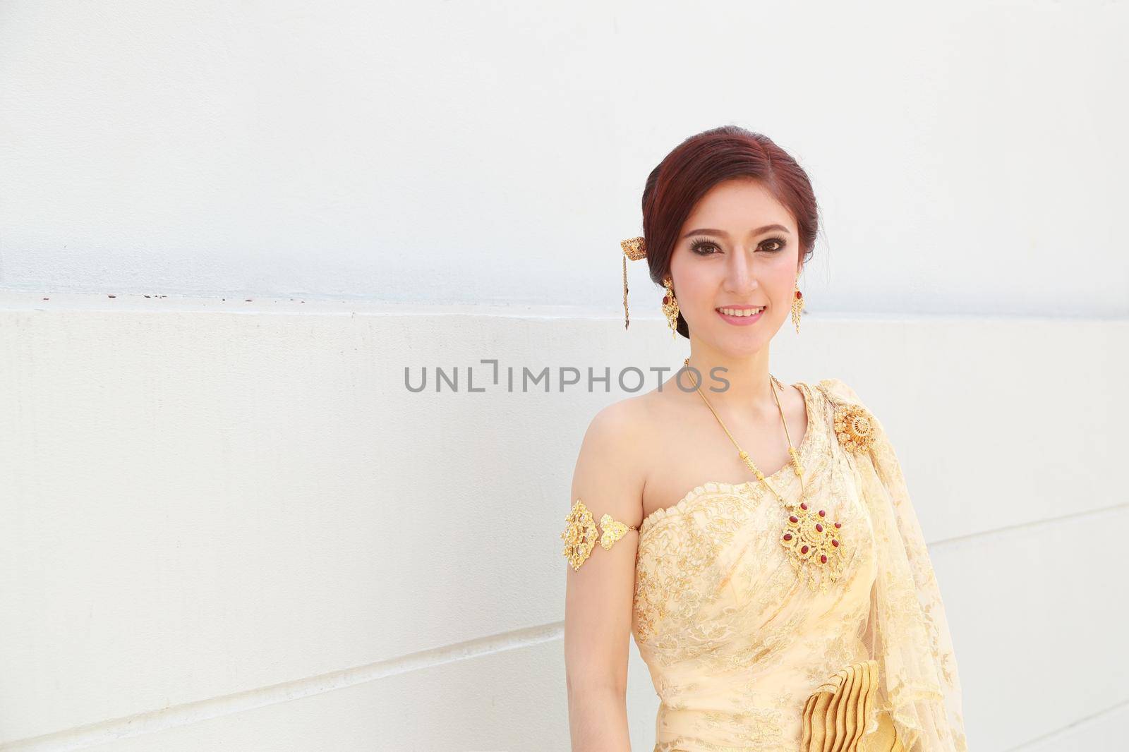 woman with Thai dress and wall background