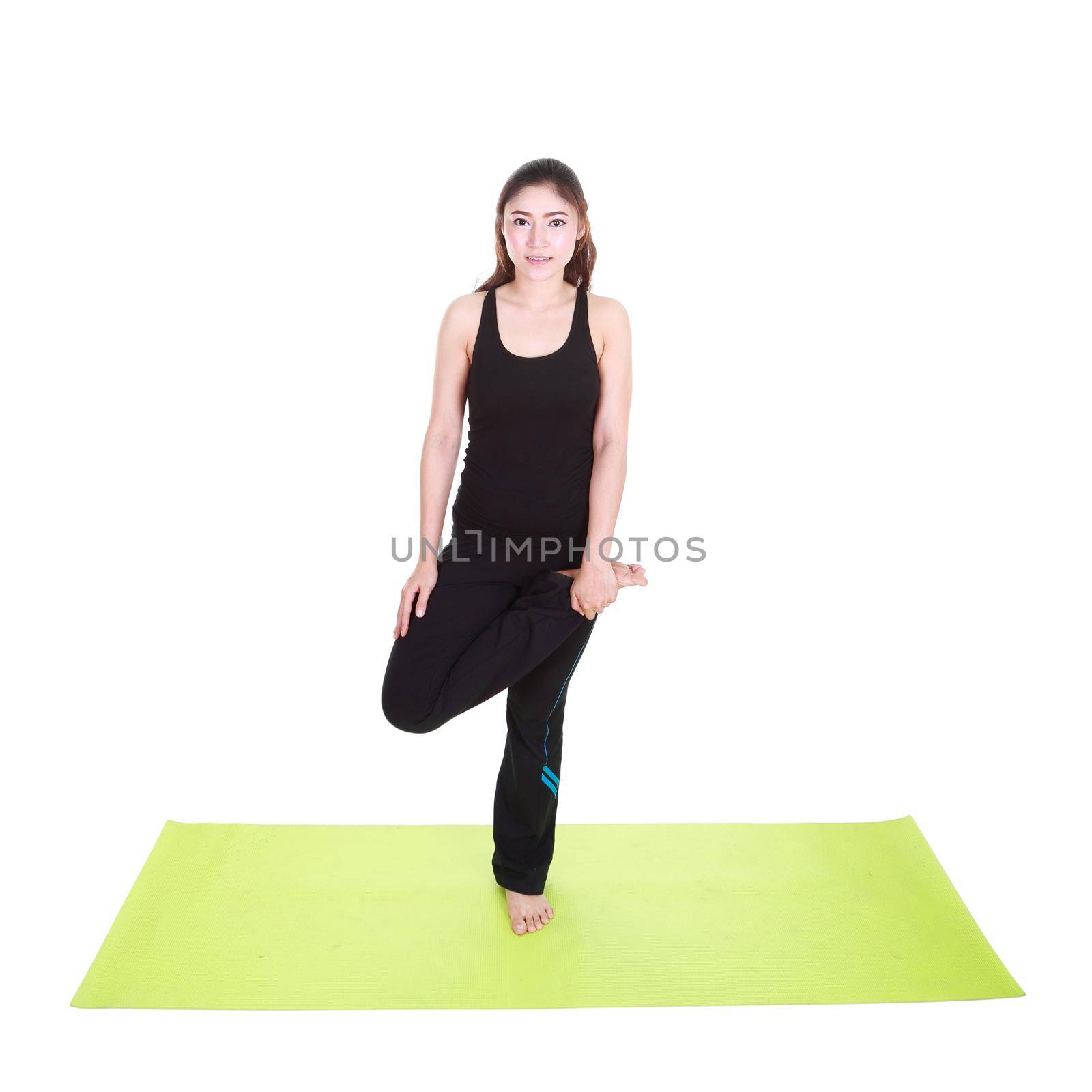 Young woman doing yoga exercise with yoga mat isolated on white background