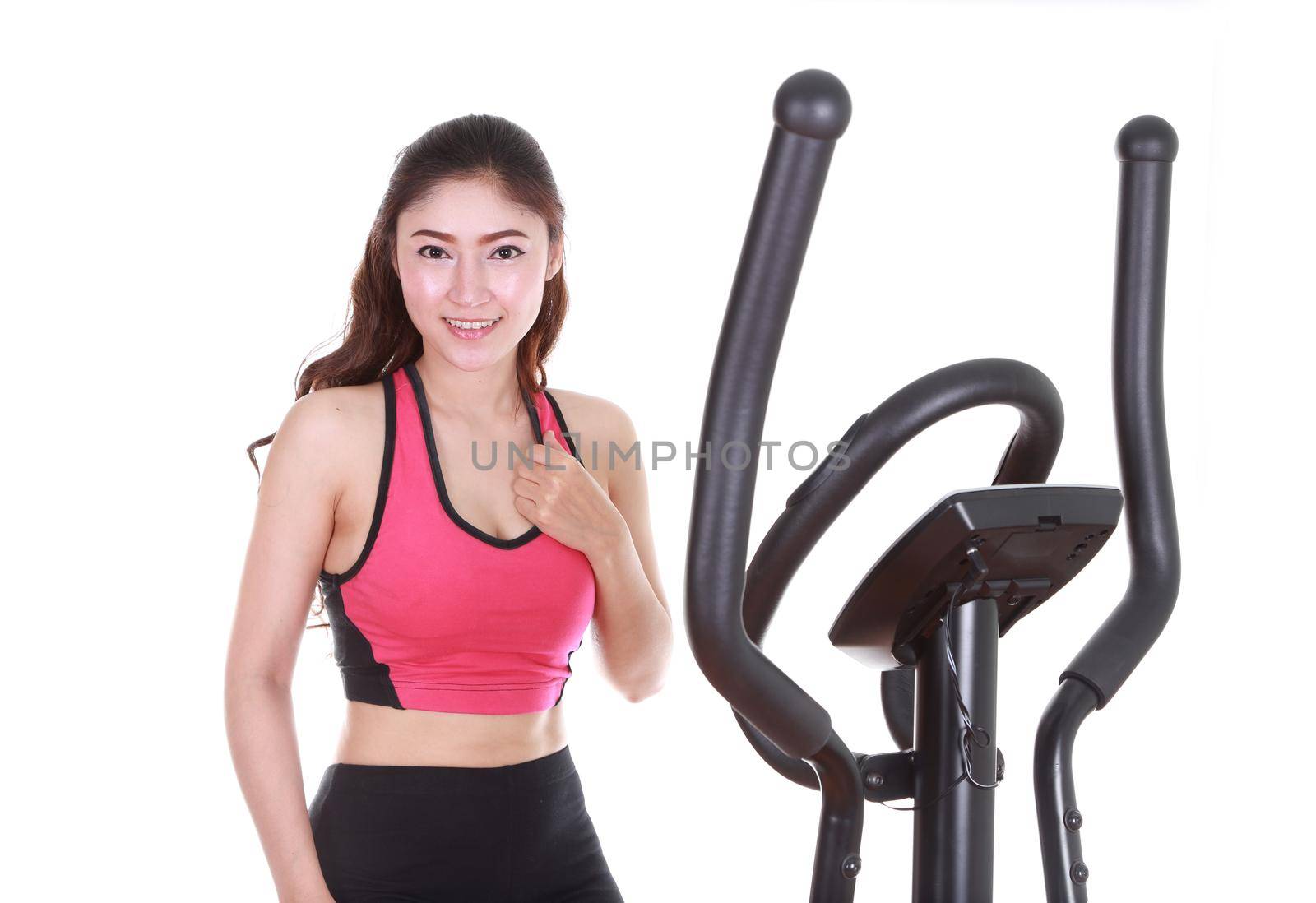 young woman doing exercises with exercise machine, on white background