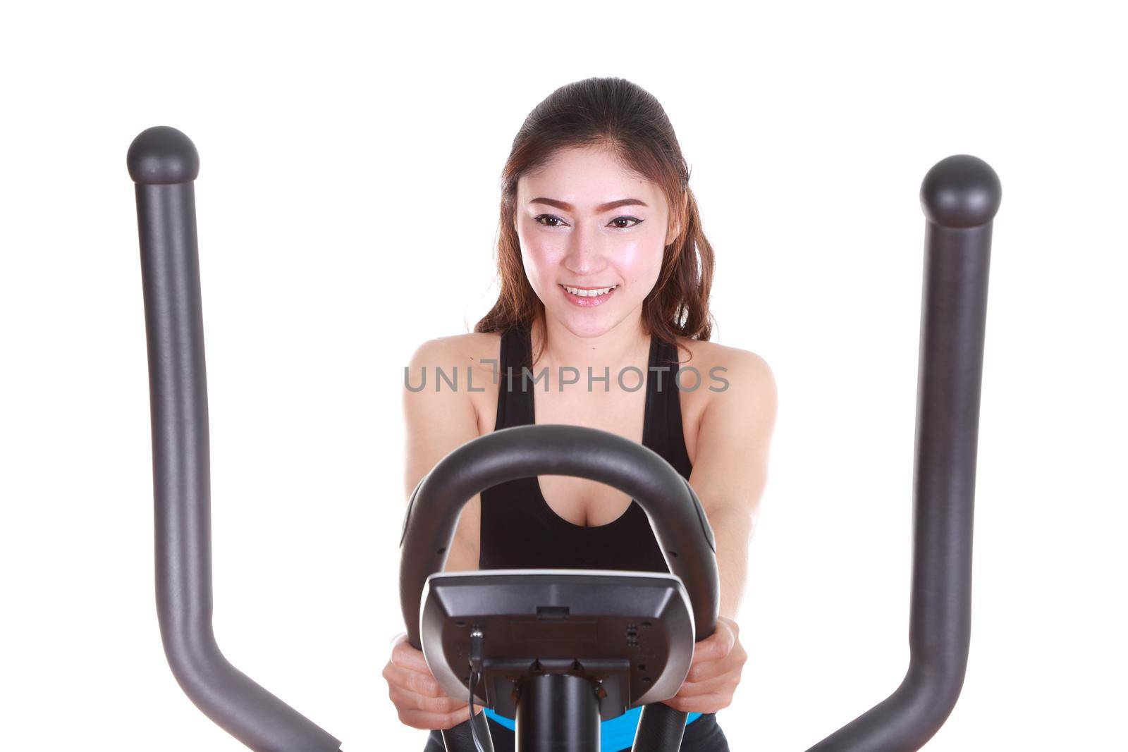 young woman doing exercises with exercise machine, on white background