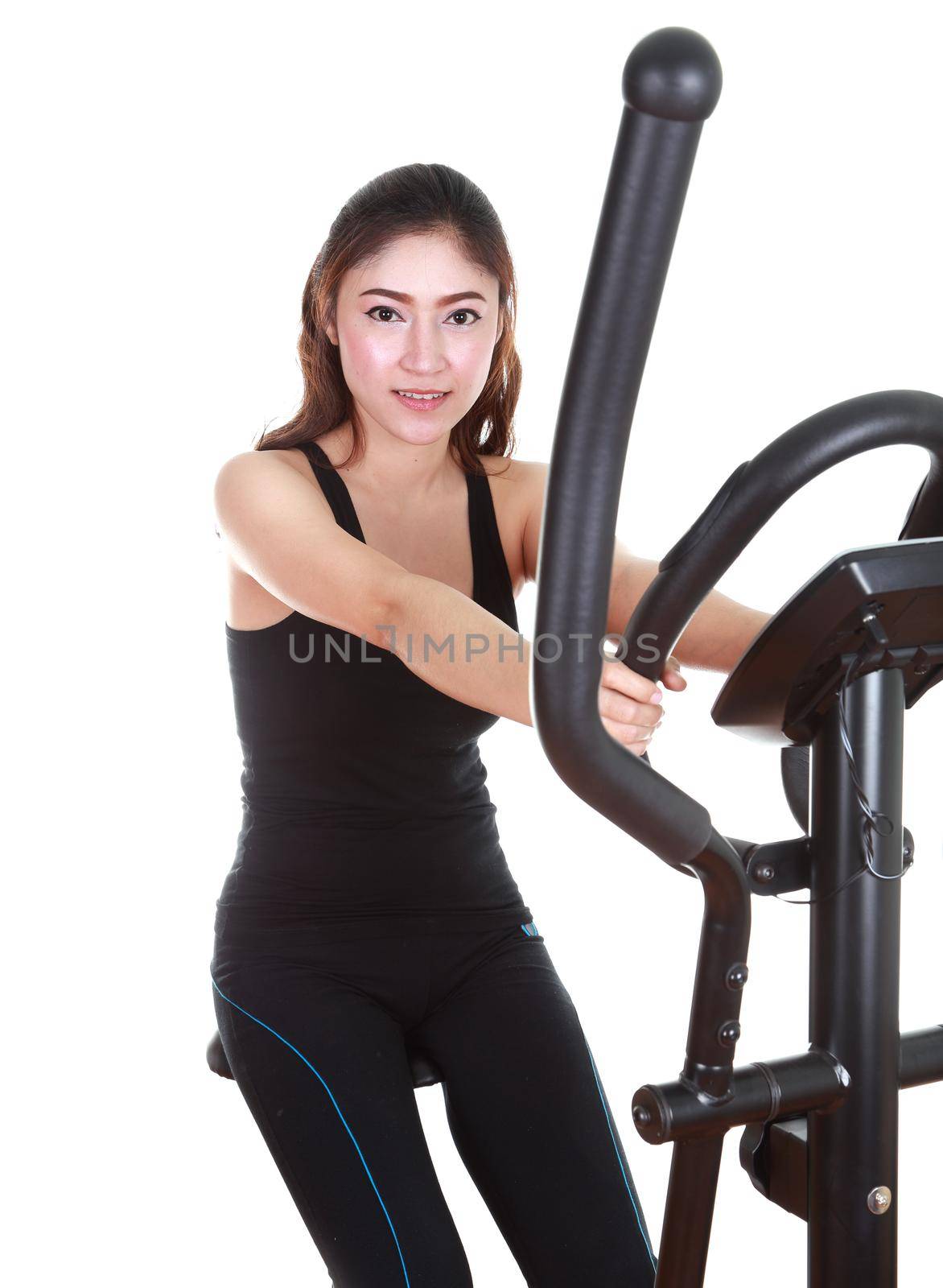 young woman doing exercises with exercise machine, on white background