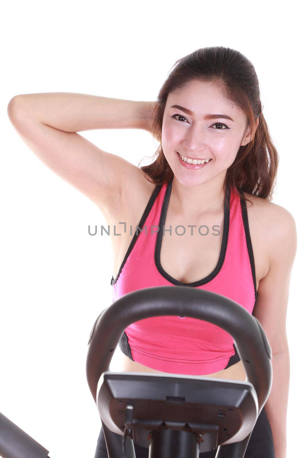 young woman doing exercises with exercise machine, on white background