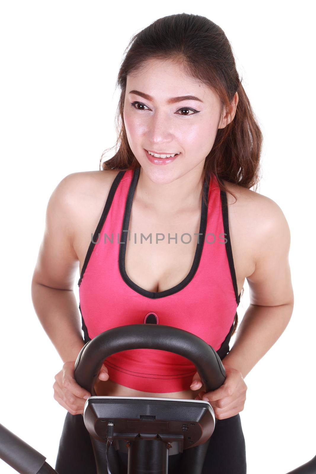 young woman doing exercises with exercise machine, on white background