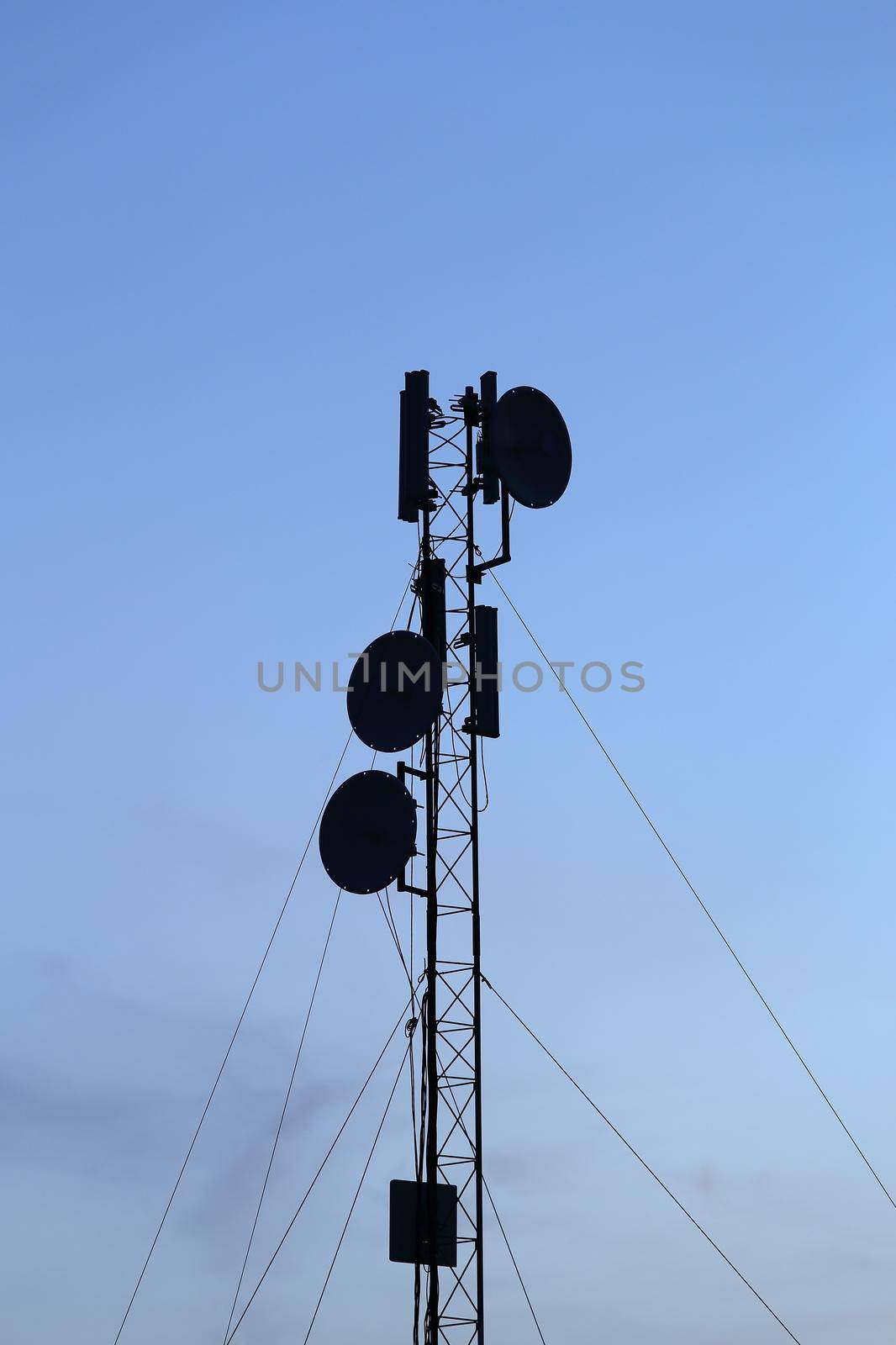 silhouette mobile antenna tower, or silhouette telephone communication tower