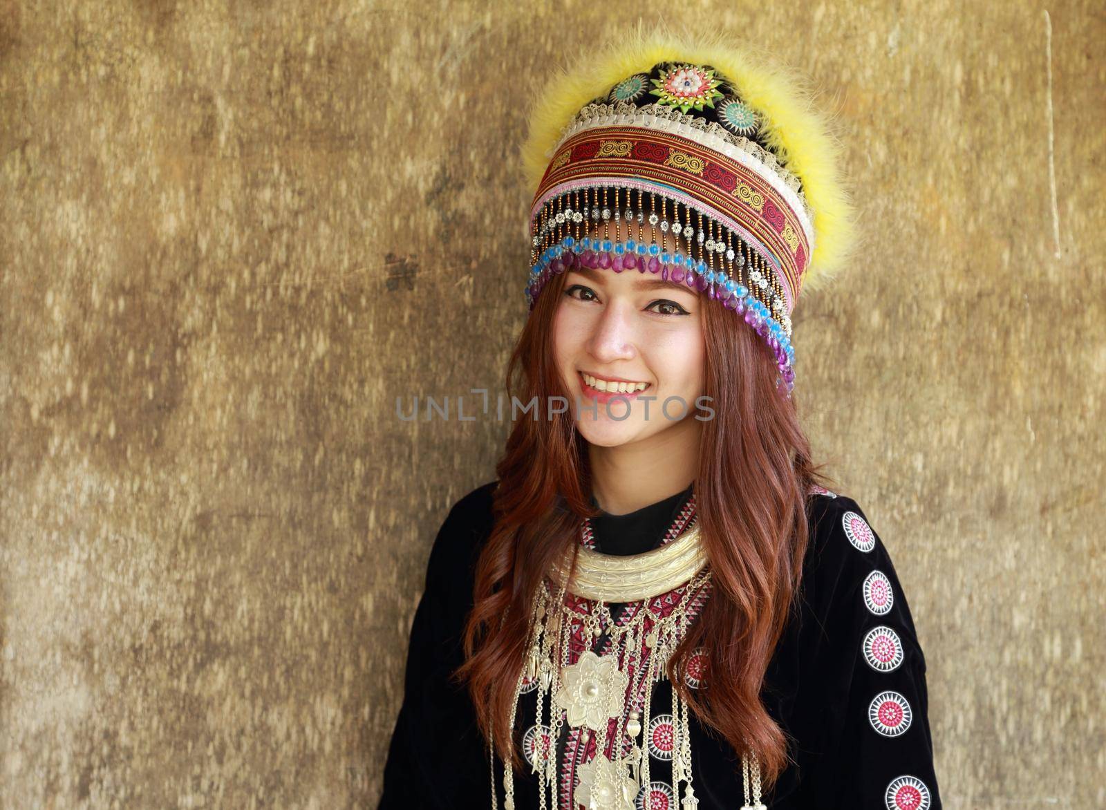 Traditionally dressed Mhong hill tribe woman in the wooden cottage