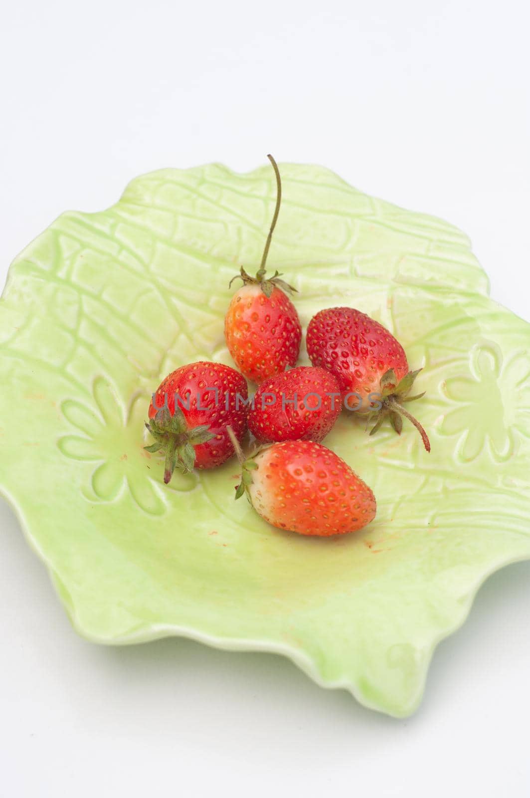 Colorful bright green cocktail cactus with strawberries, delicious refreshing summer drink, tonic drinks. High quality photo