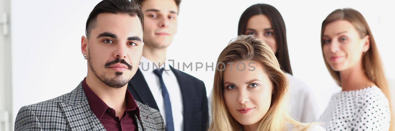 Portrait of smart confident team of successful people, coworkers pose for collective picture. Clever employees in suits. Business, teamwork, career concept