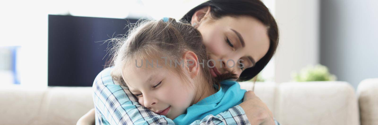 Portrait of mother and daughter hugging, smiling and receive dose of love. Kid spend time with parent, kindness and comfort. Family relationship concept