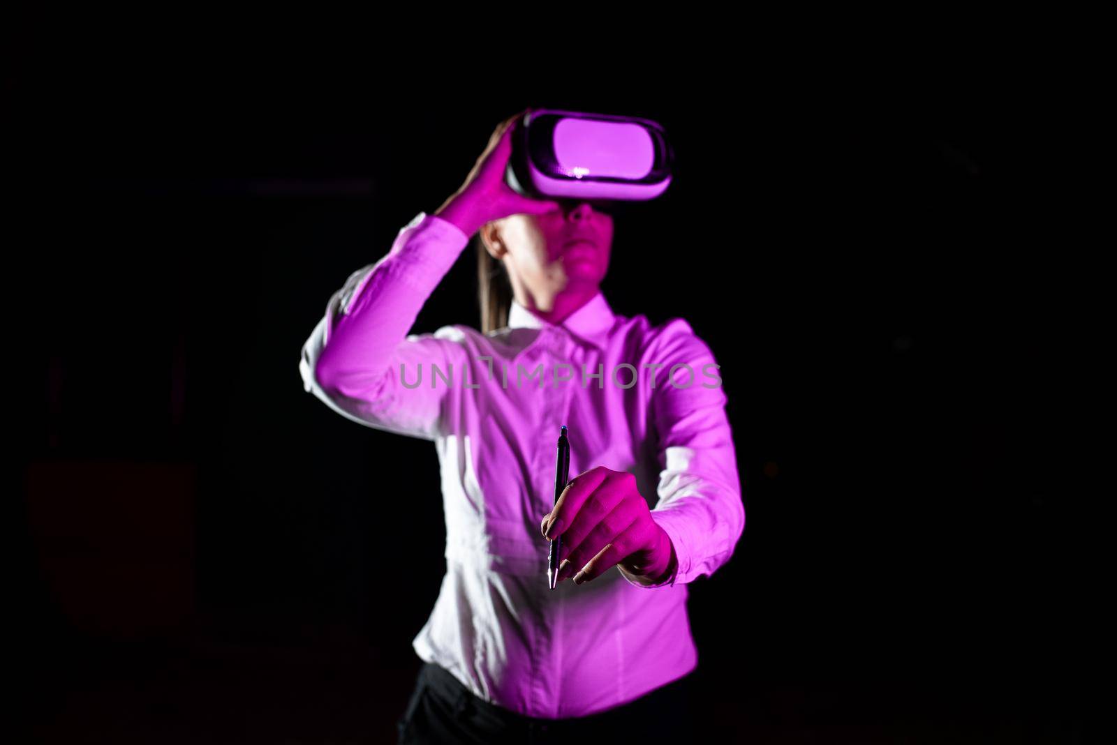 Woman Holding Pen During Professional Training Through Vr Headset.