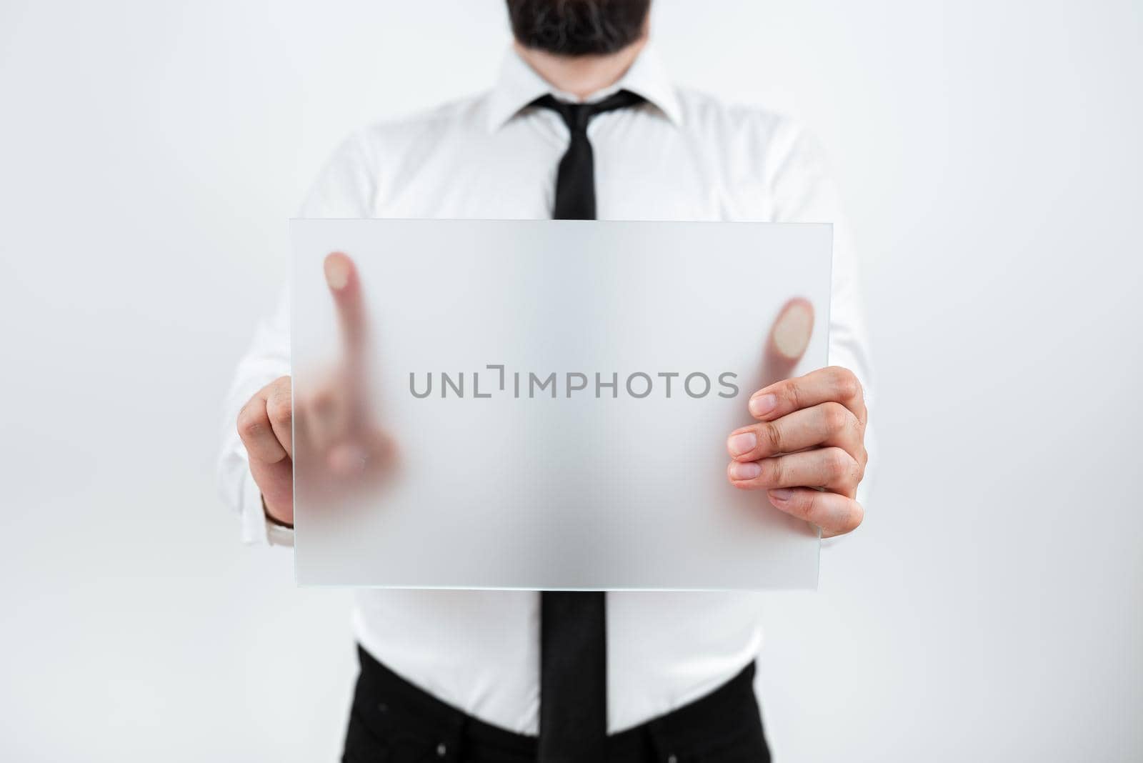 Man Holding Placard Presenting Marketing Strategies For Development.