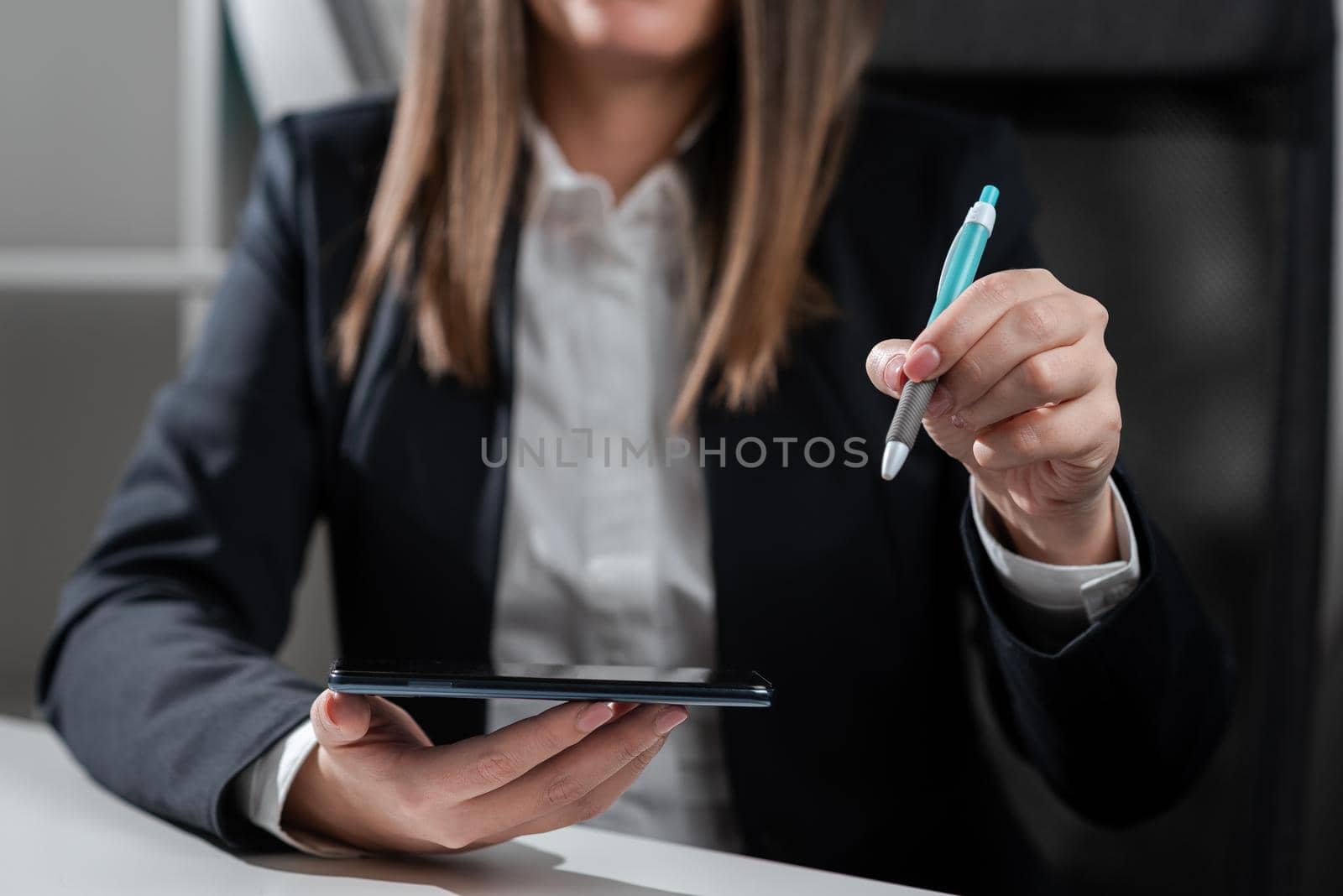 Woman Holding Tablet And Pointing With Pen On Important Idea.