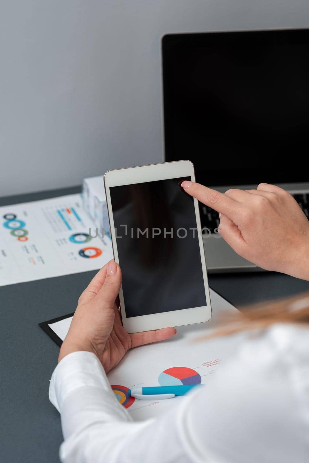 Businesswoman Holding Tablet And Pointing On Important Messages.