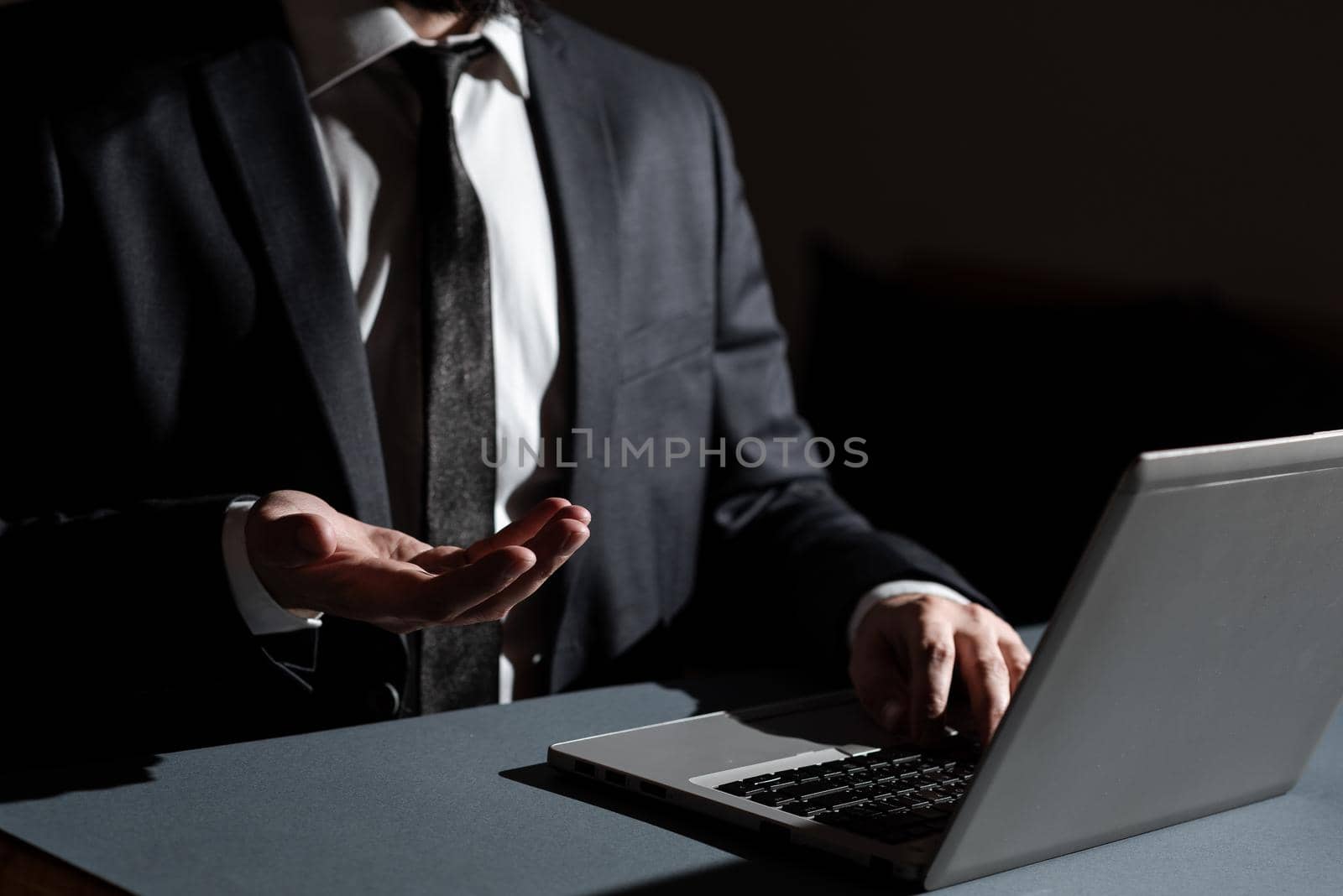 Man Typing Important Data Into Laptop And Presenting New Idea Over Hand.