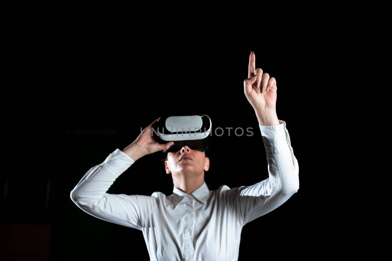 Woman Wearing Virtual Reality Simulator And Gesturing During Training.