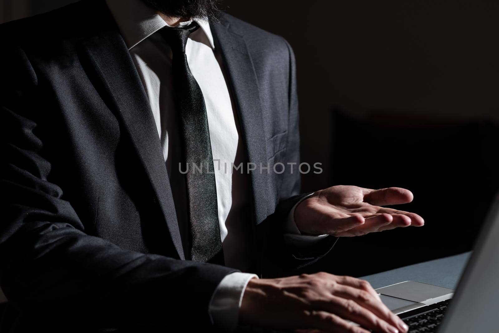 Man Typing Important Data Into Laptop And Presenting New Idea Over Hand.