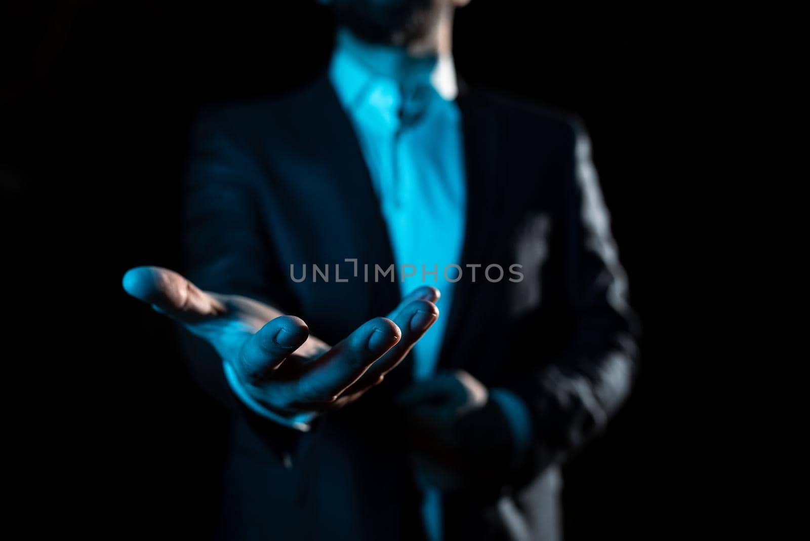 Businessman Holding And Presenting Important Informations On Hand.