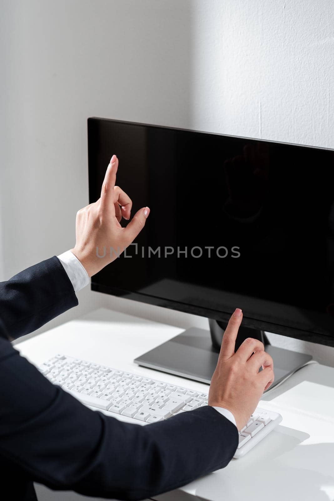 Businesswoman Pointing With Two Fingers On Important Messages. Executive In Suit Presenting Different Crutial Information. Woman Showing Critical Announcements. by nialowwa