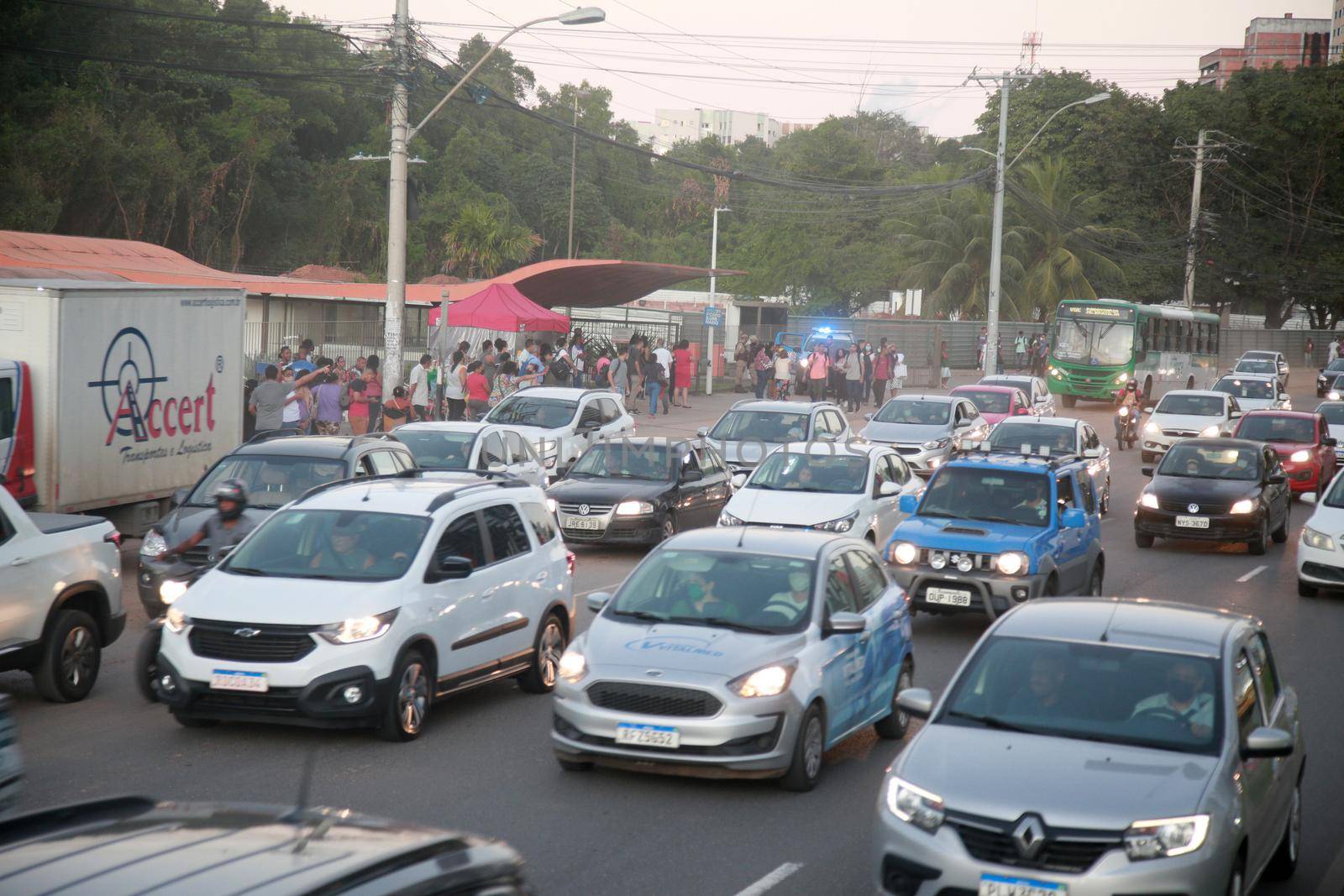salvador, bahia, brazil - july 19, 2022: passengers waiting for a public transport bus at a stop in the city of Salvador.