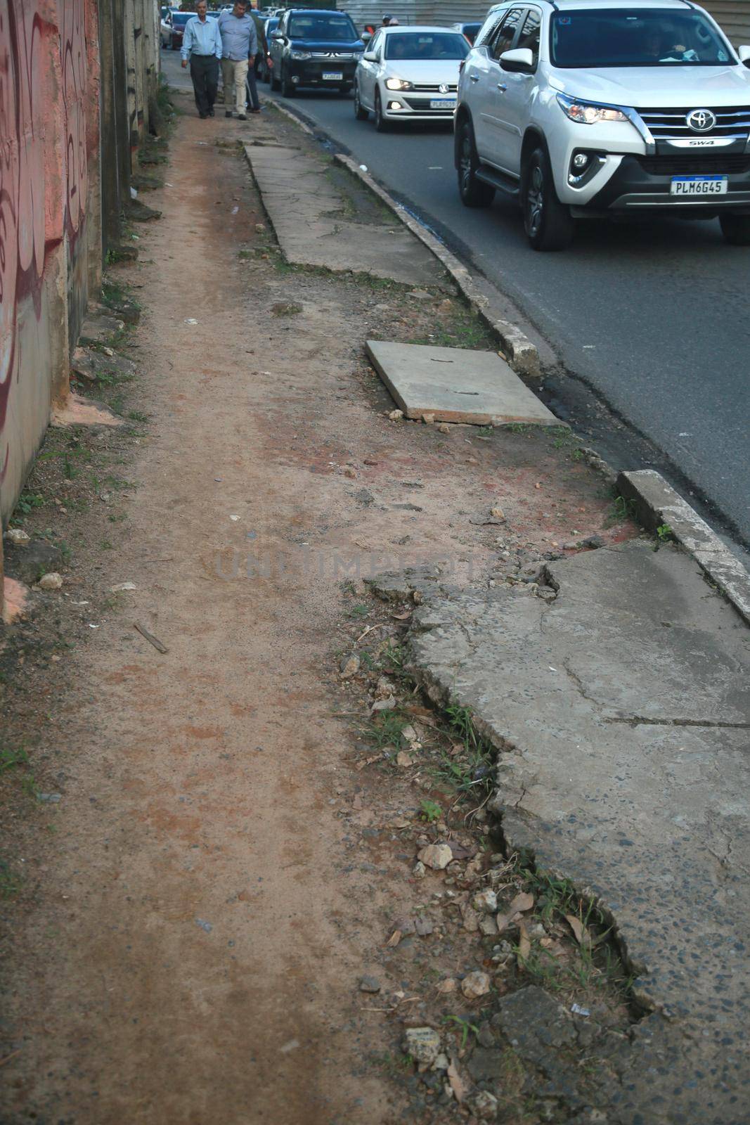 salvador, bahia, brazil - july 19, 2022: Pedestrian sidewalk with damaged floor on a street in Salvador city.